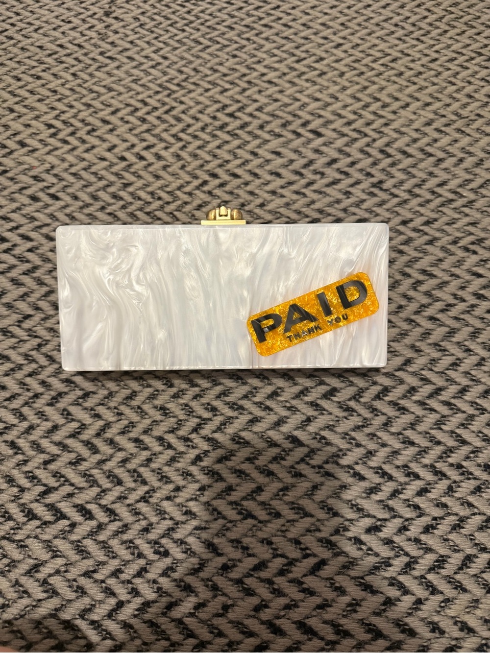 Edie Parker “PAID” clutch